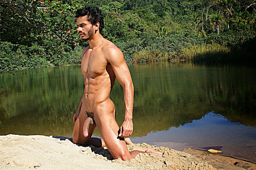 Naked Sun-tanned young guy Walking outdoors naked
