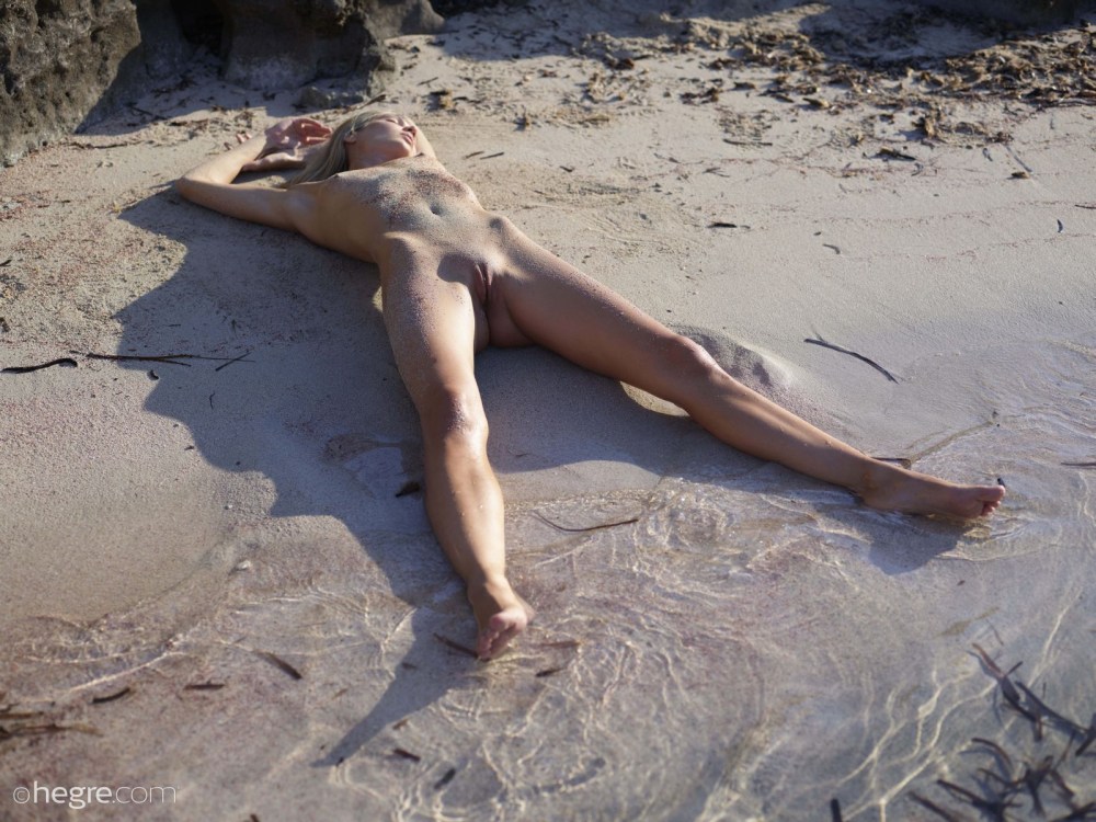 Nude model Francy posing on Beach in Ibiza